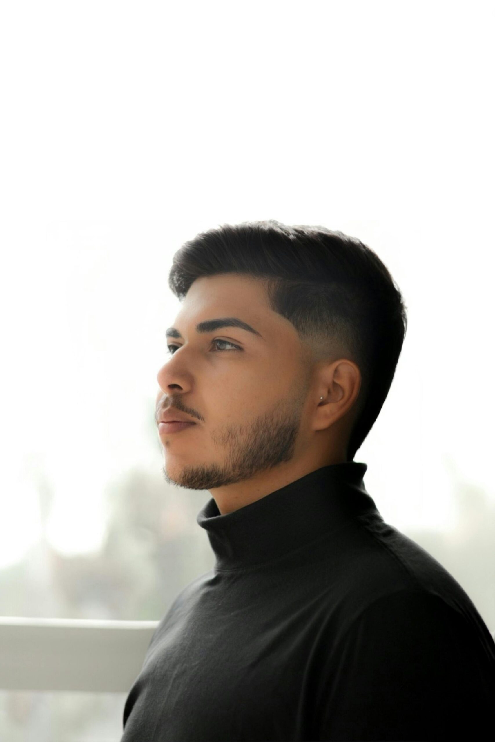 Elegant portrait of a man in a black turtleneck, Sete Lagoas, Brazil.